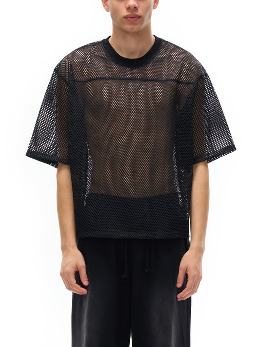 Model wearing the sustainable Future-Homme activewear boxy mesh tee in black frontside on a white background.