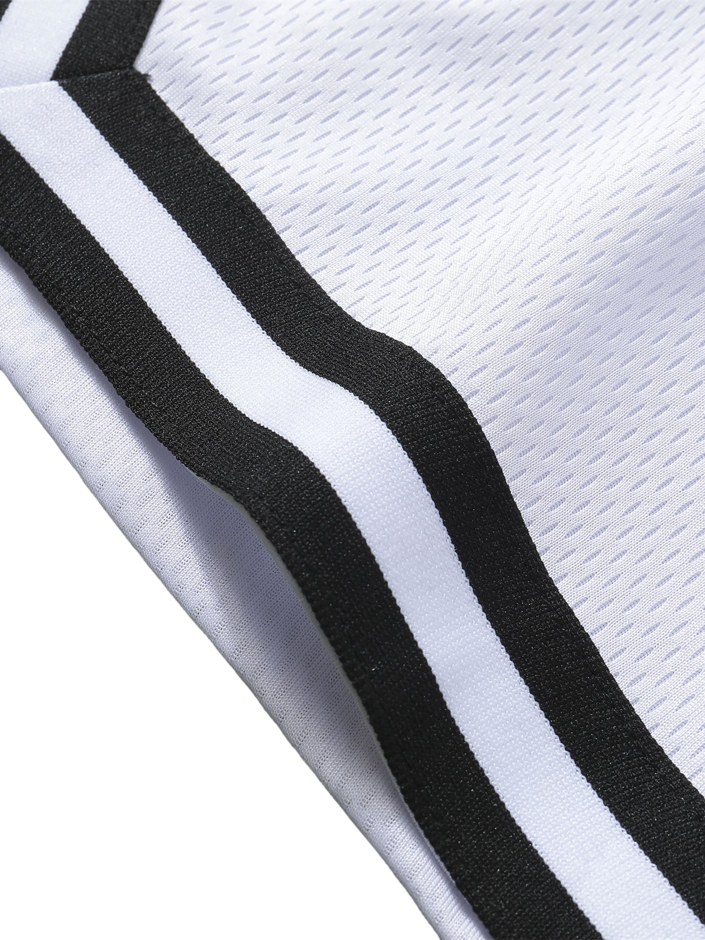 Detail stripe trim of the sustainable Future-Homme activewear classic stripe trim basketball short in white leg on a white background