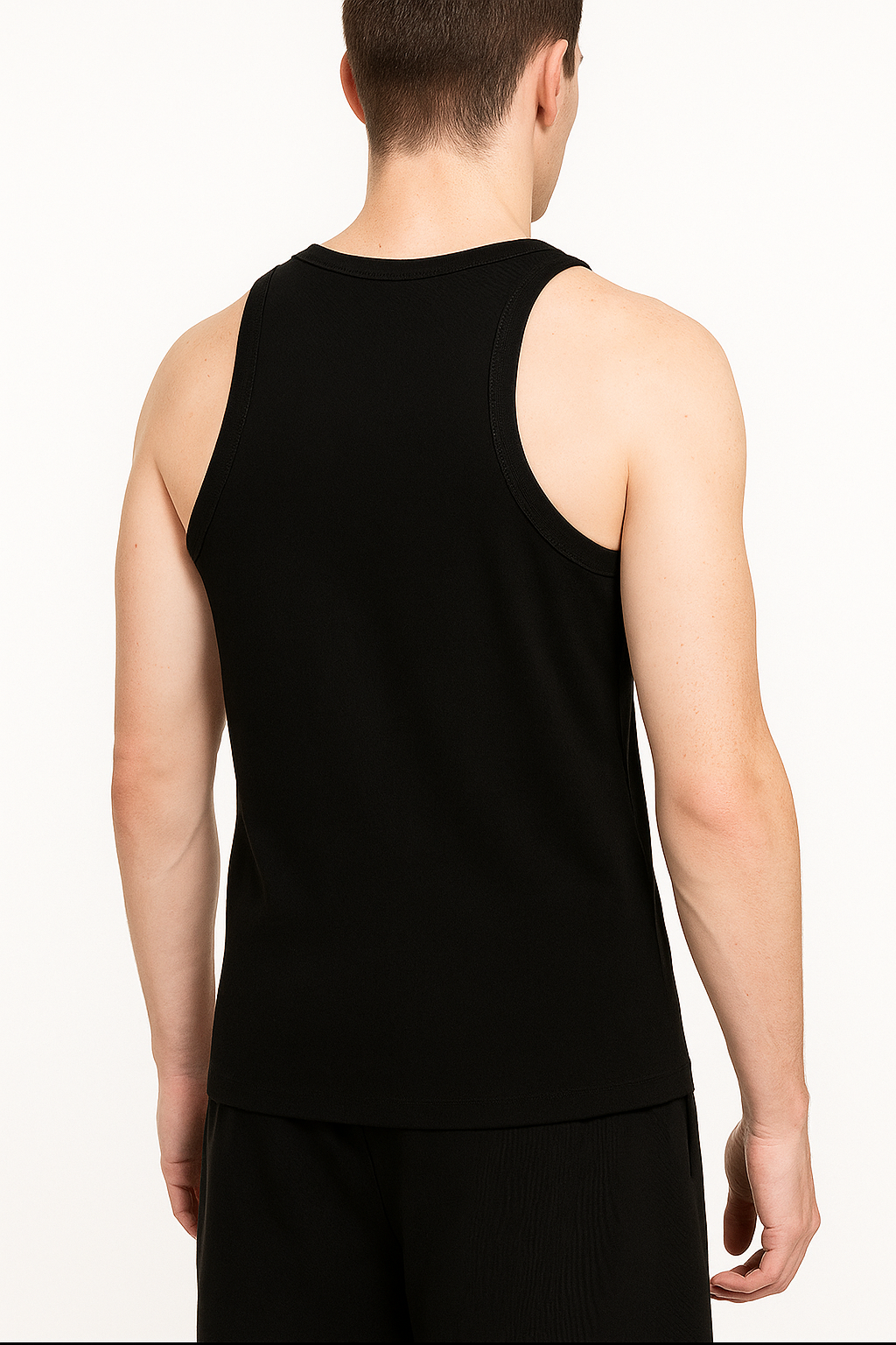 Model wearing the sustainable Future-Homme activewear cotton tank top in black backside on a white background