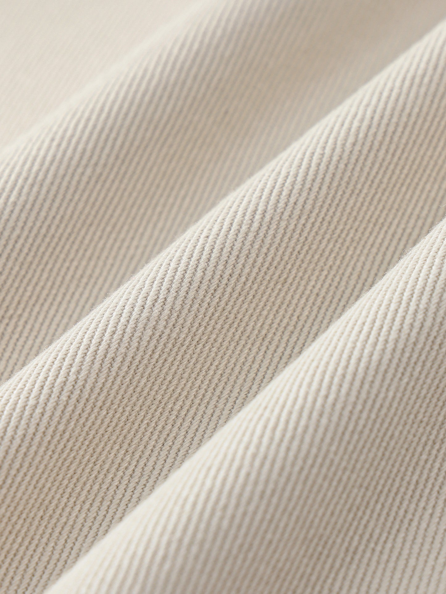 Cotton twill fabric swatch of the Future-Homme heavyweight cotton straight leg pants in pale khaki
