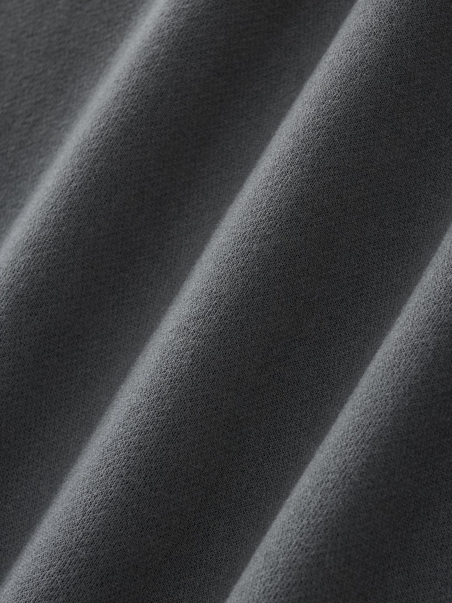 Close up image of a fabric swatch of the Future-Homme three quarter length sweatpant in Black