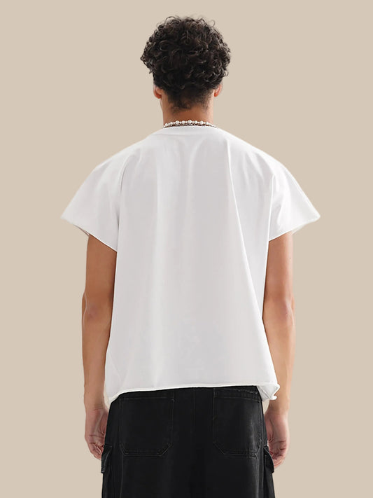 Person wearing a white t-shirt and black pants on a white background
