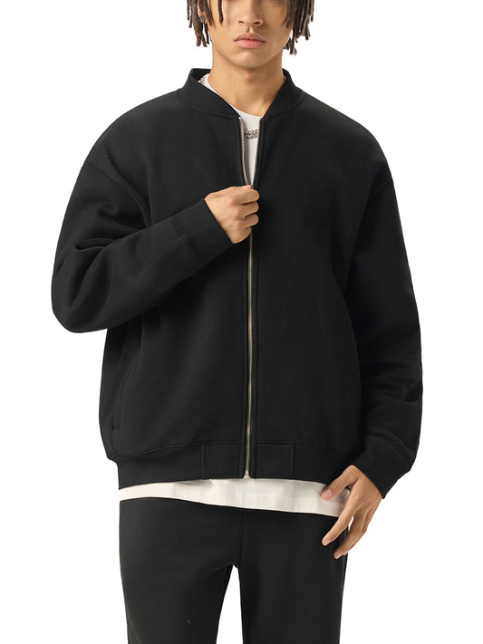 A Future-Homme model wearing the Fleece Please Varsity Jacket front side in black on a white background.
