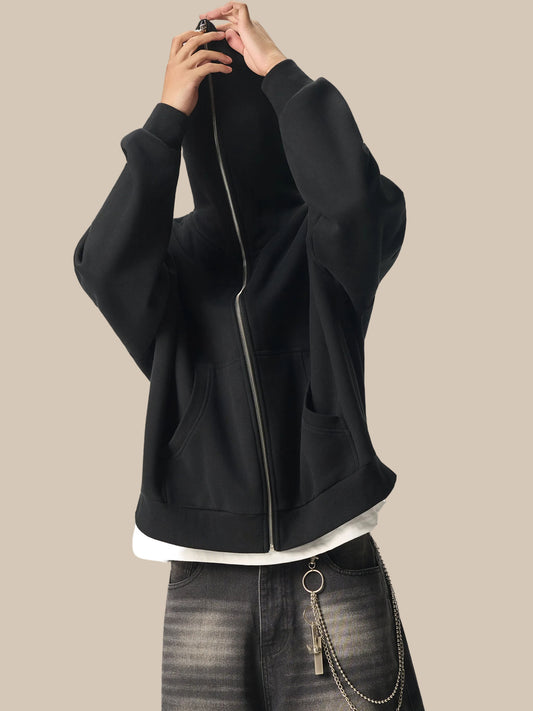 A Future-Home male mode wearing the Fleece Please Full zip hoodie zipped all the way to the top with gray jeans on a white background.