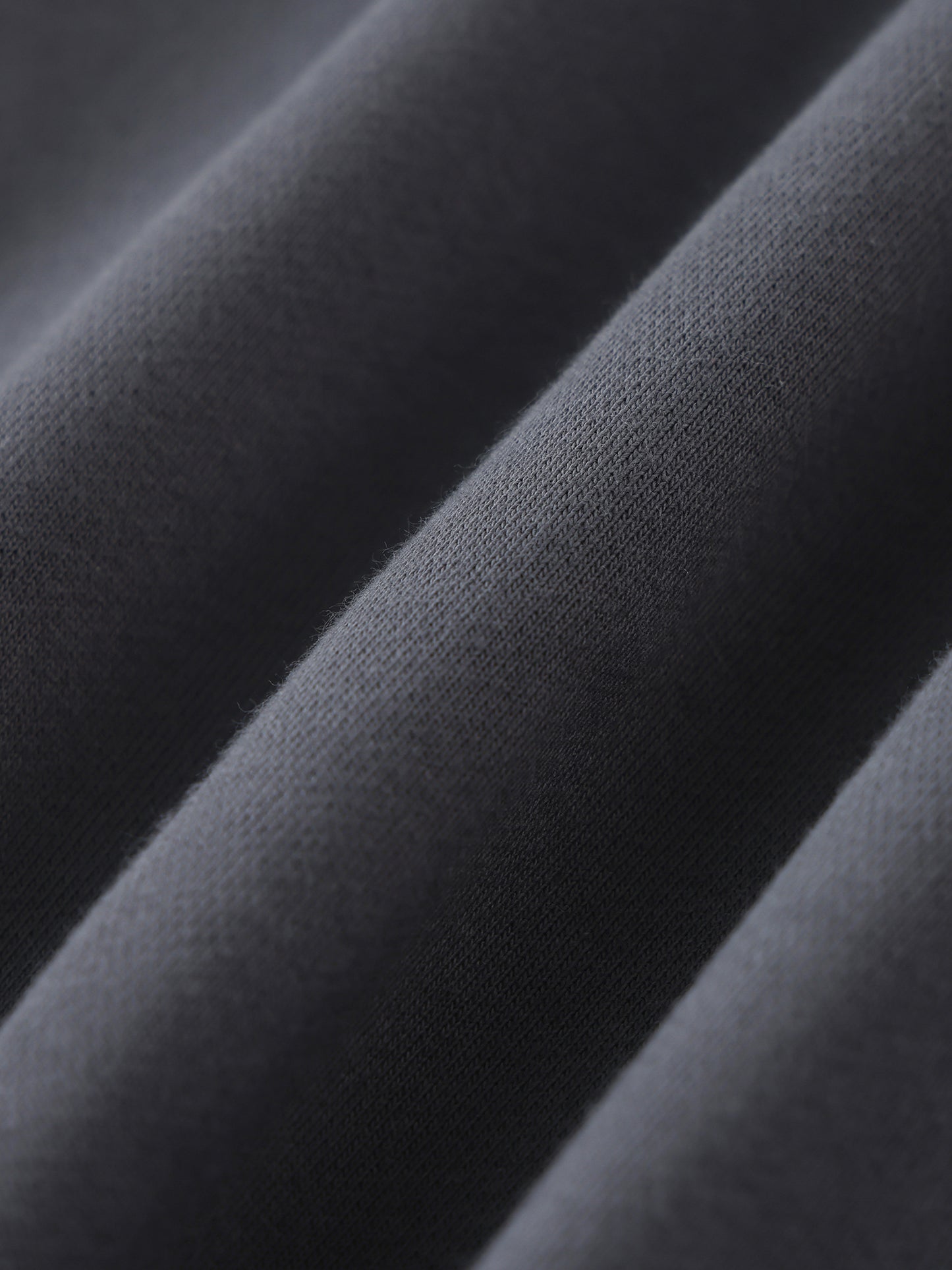 Future-Homme fabric swatch of Close-up of dark gray fabric with a textured surface