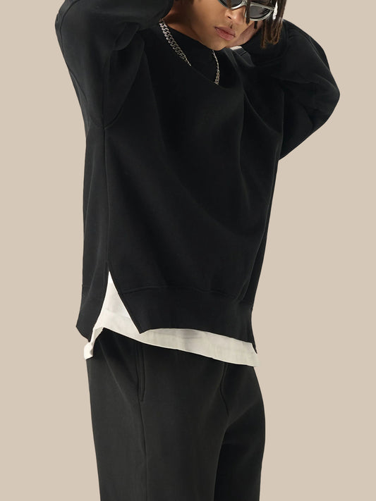 Future-Homme model wearing a Fleece Please Side Slit Pullover from a side view on a white background.