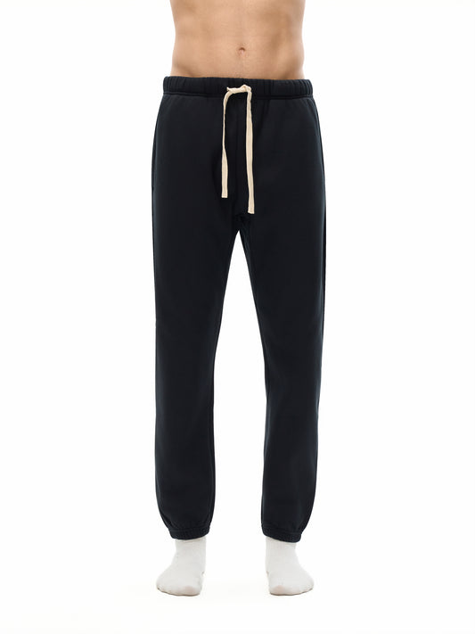 A Future-Homme model wearing the Fleece Please Sweatpants front side on a white background.