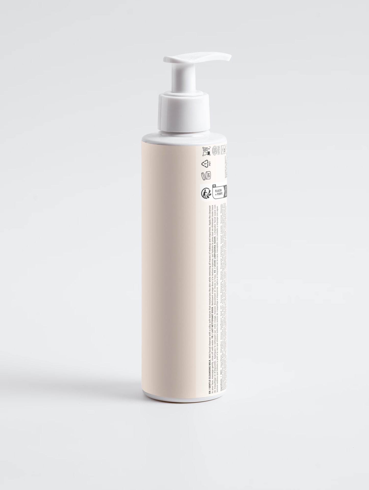 Beige bottle with pump on a light gray background