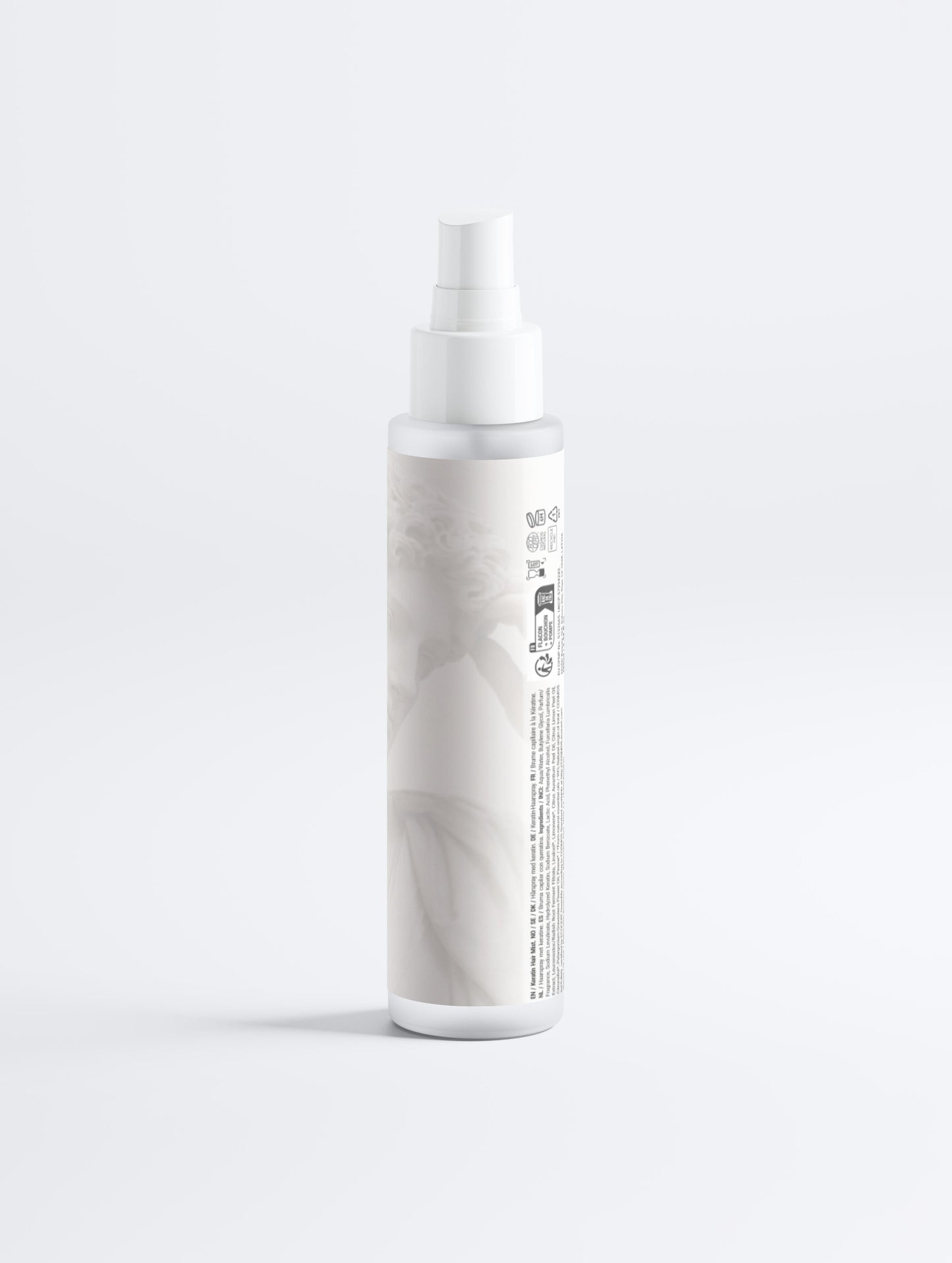 White spray bottle with marble pattern on a light gray background