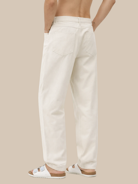 Person wearing beige pants on a white background