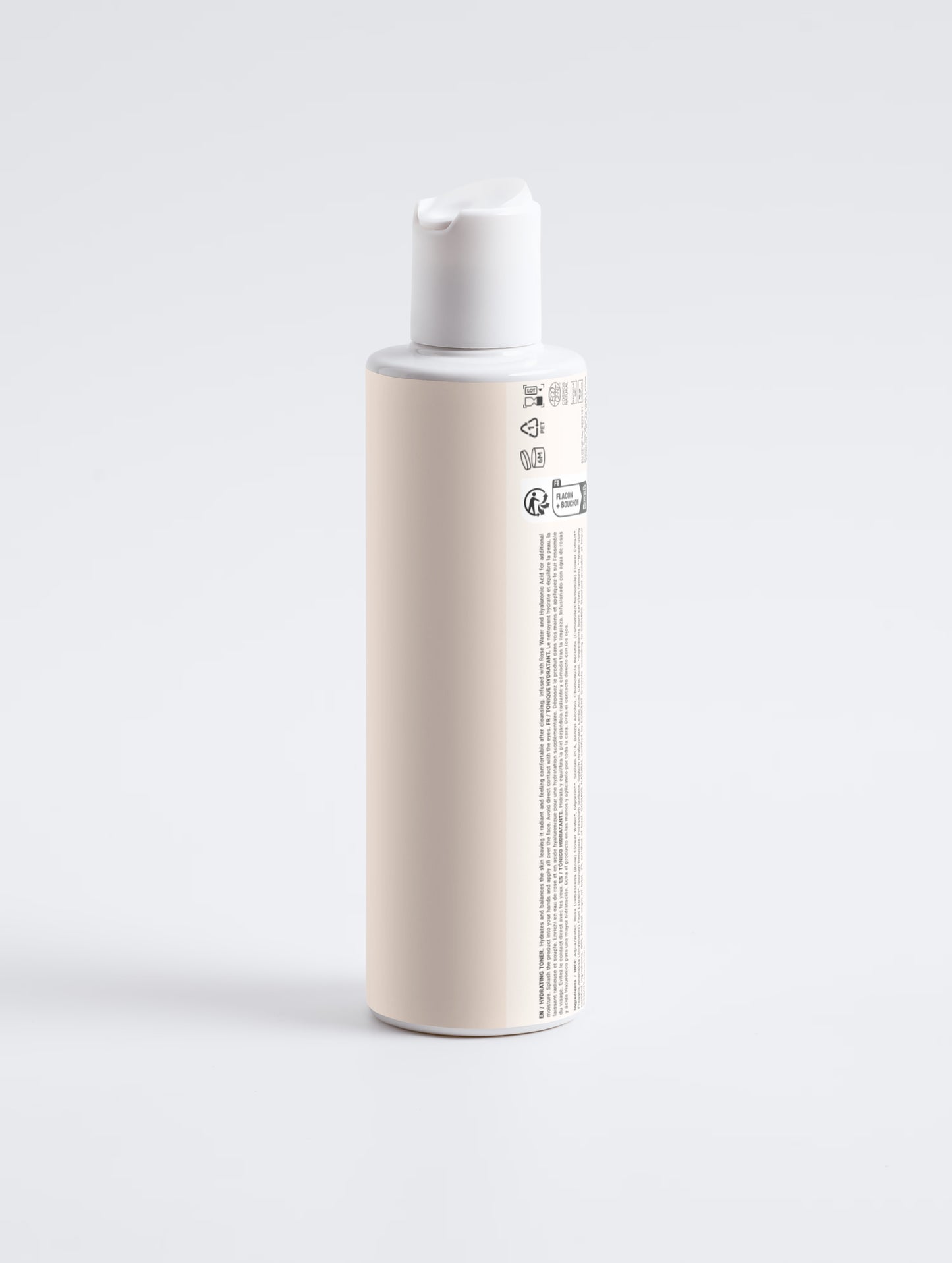 Skincare bottle with a white cap on a light gray background