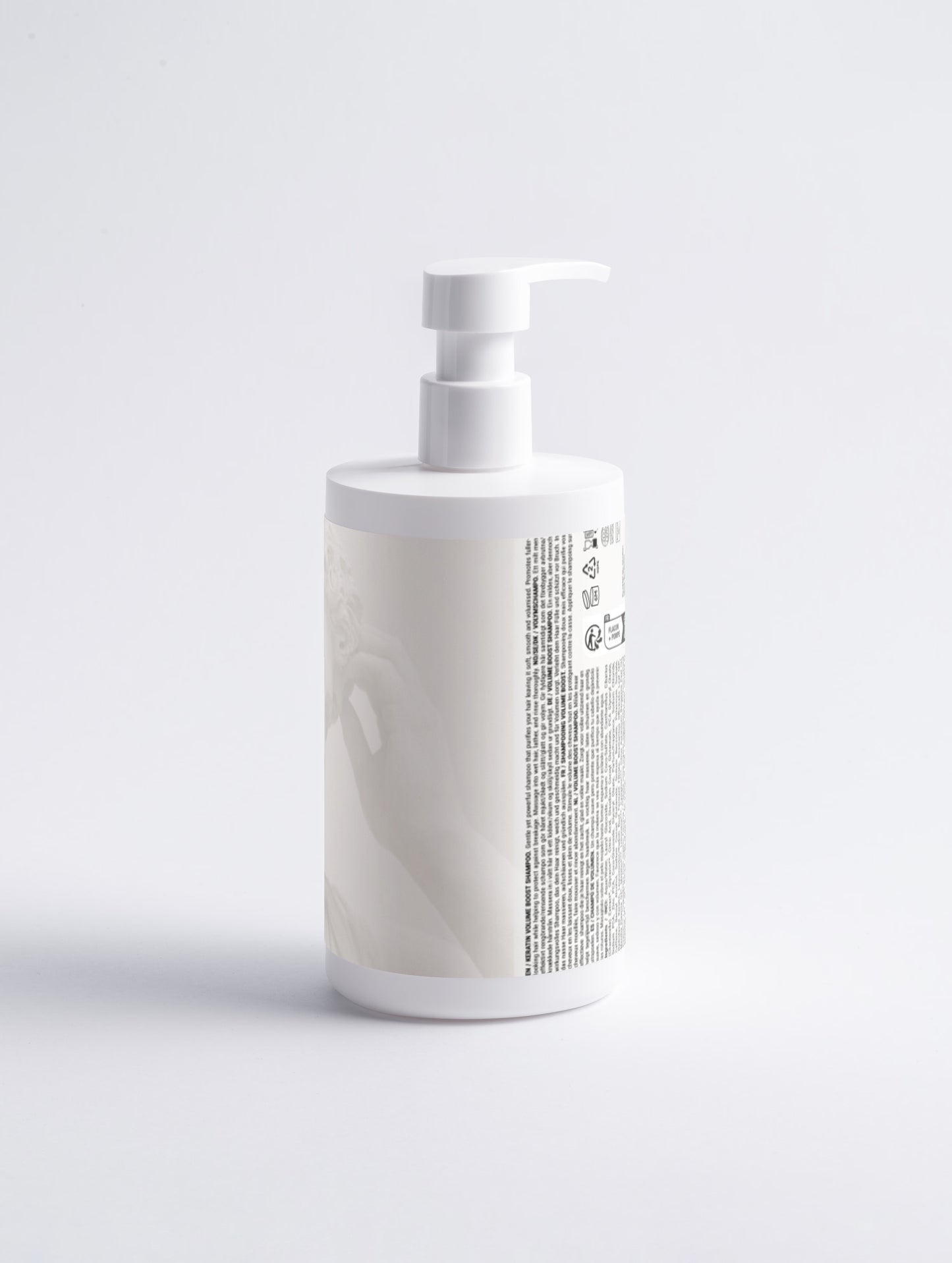 White bottle with pump dispenser on a light gray background