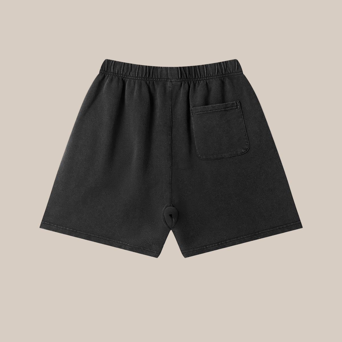 Black shorts with a pocket on a beige background