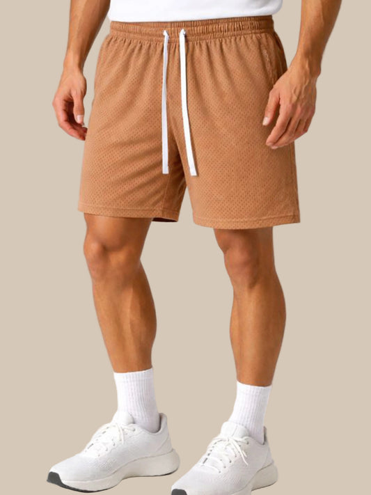 Person wearing brown shorts with a white drawstring on a white background