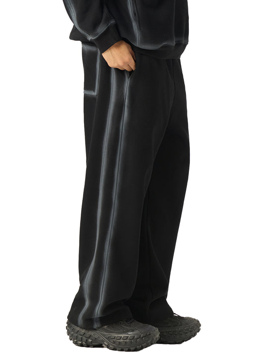 A model wearing the Future-Homme Ombre Effect Fleece Sweatpants in black front side view on a white background.