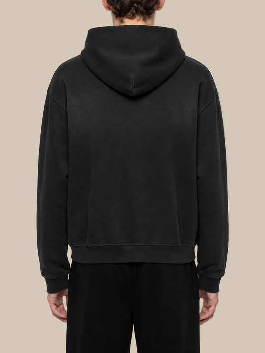 Person wearing a black hoodie from behind on a white background
