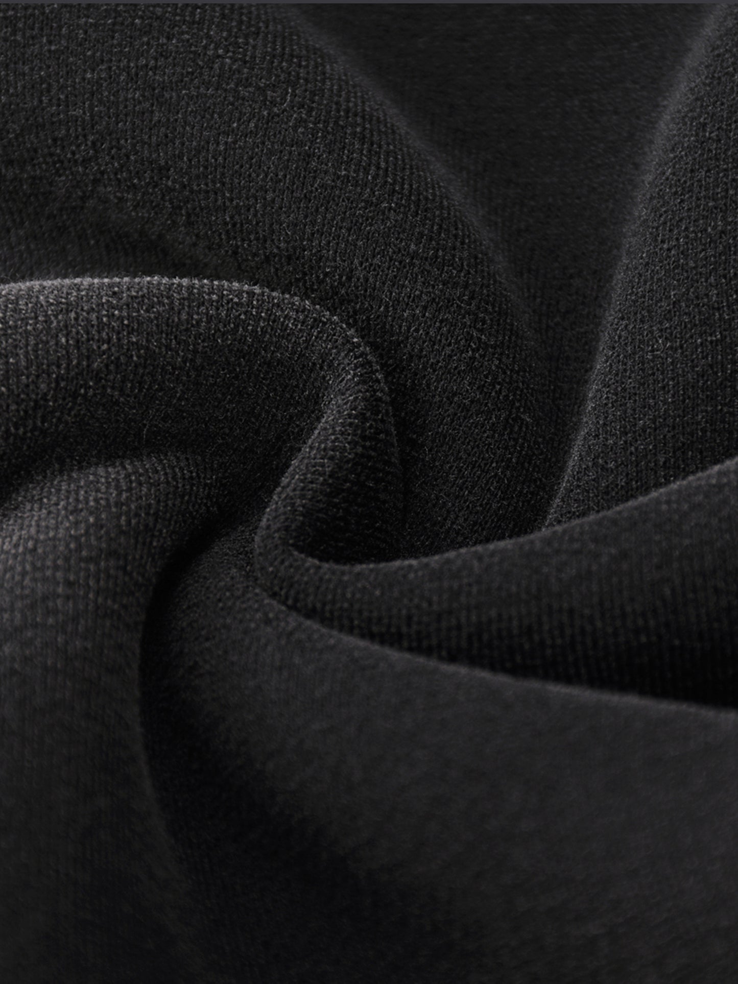 Close-up of black fabric with a textured pattern