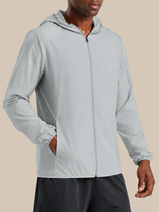 Person wearing a light gray hooded jacket on a white background