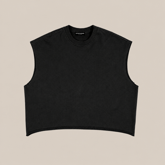 A black sleeveless crop top with a crew neck, laid flat against a solid beige background.