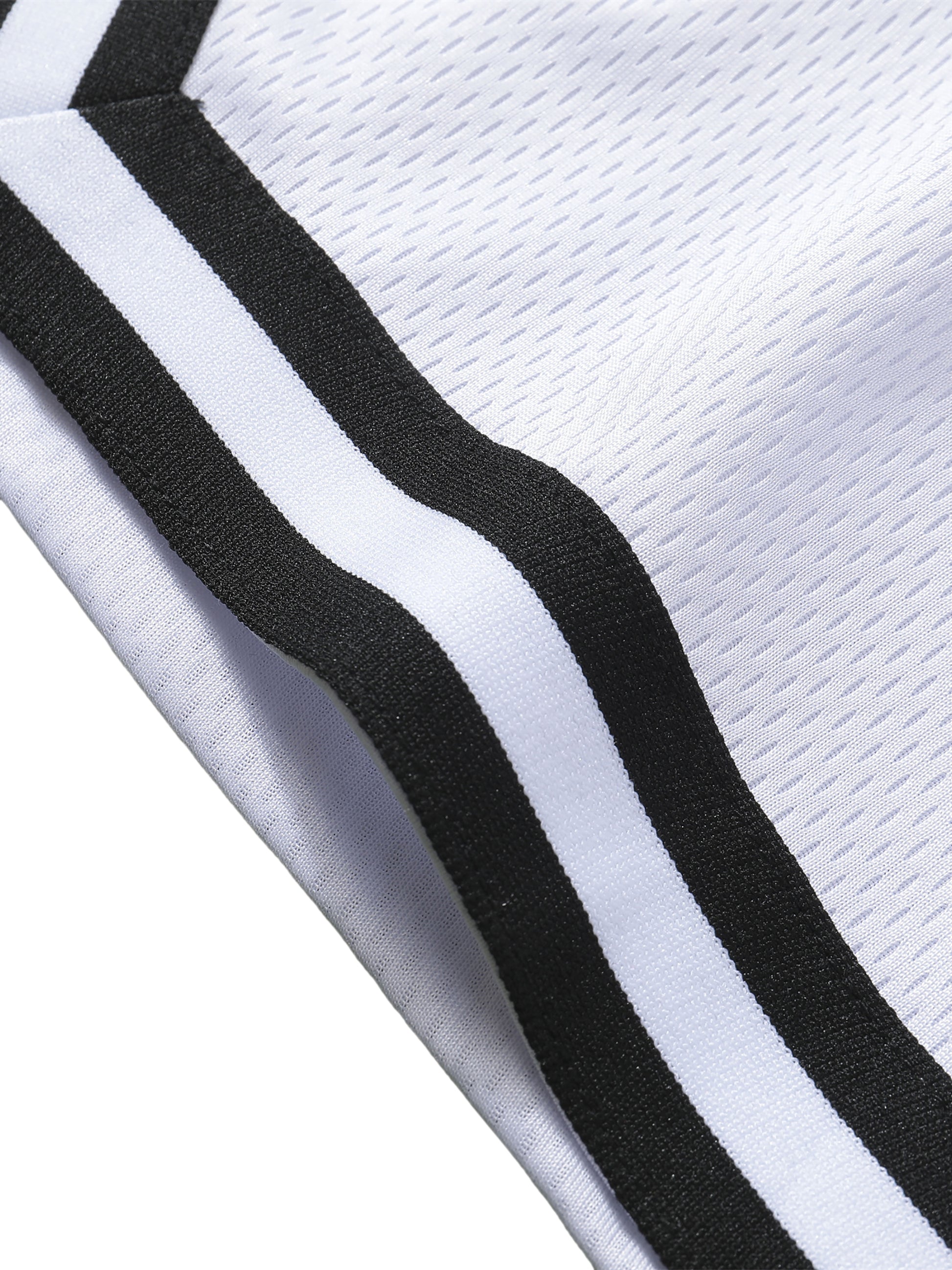 Detail stripe trim of the sustainable Future-Homme activewear classic stripe trim basketball short in white leg on a white background