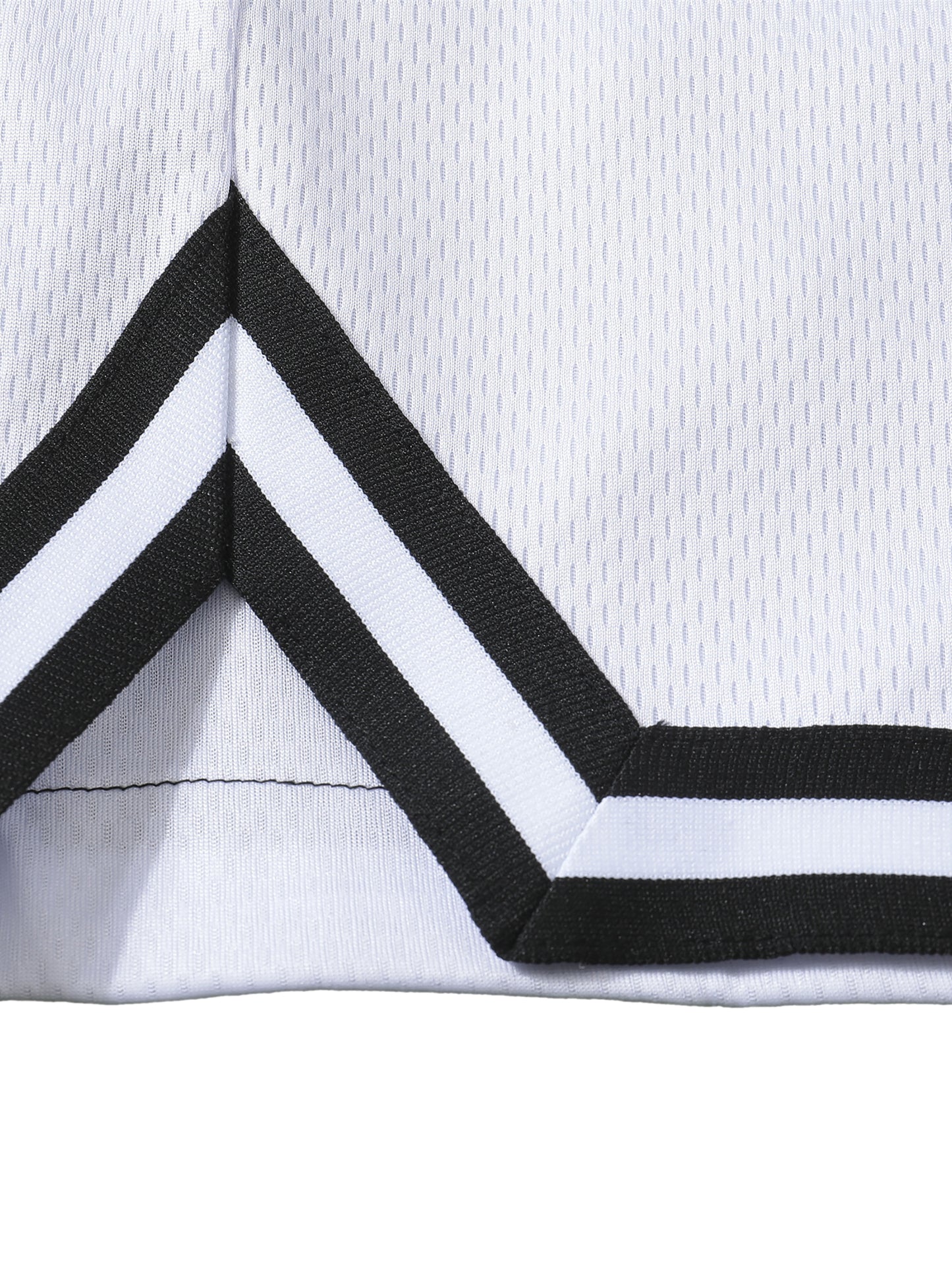 Detail stripe trim of the sustainable Future-Homme activewear classic stripe trim basketball short in white side on a white background