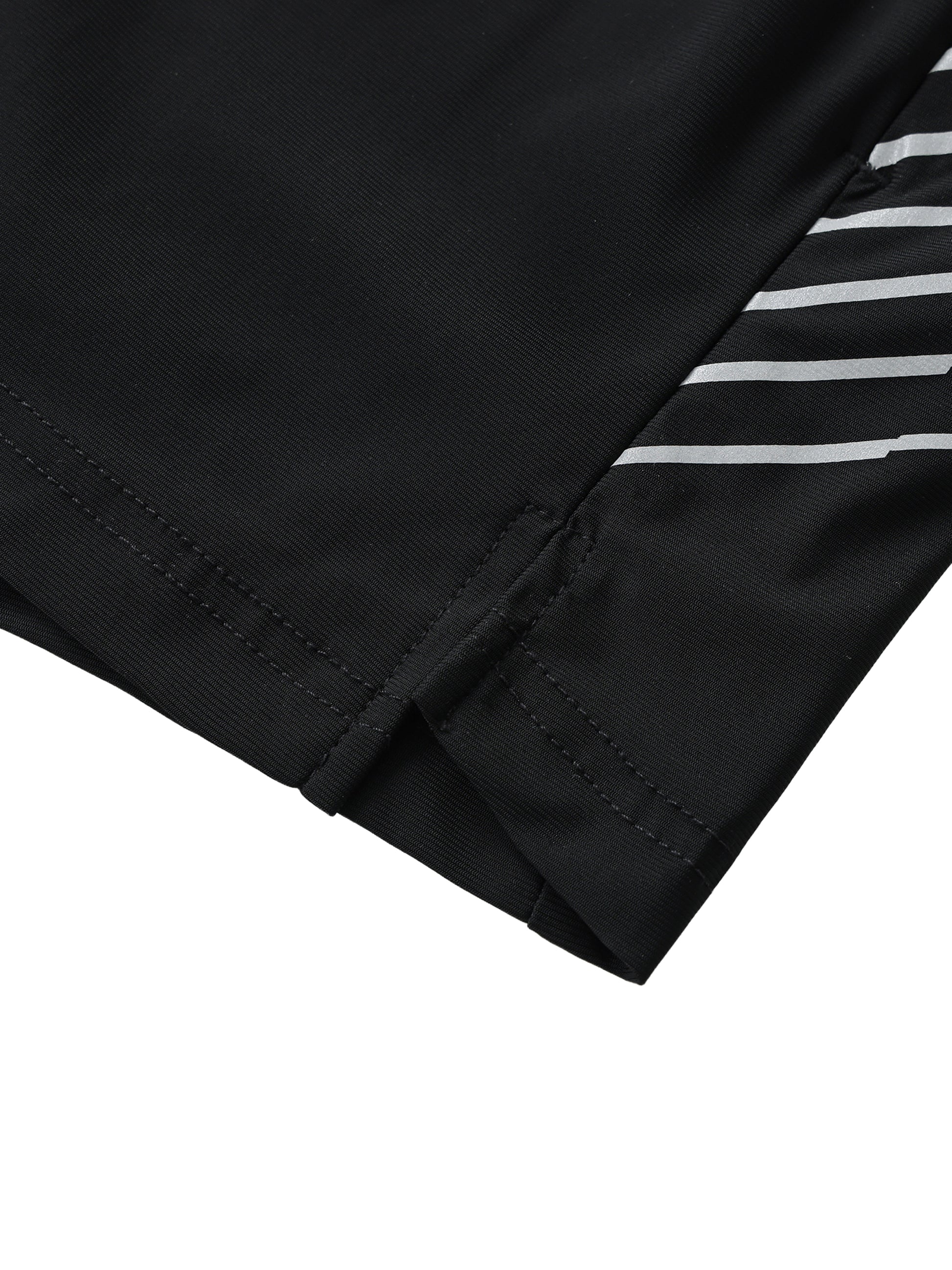 Flat lay of the Future-Homme activewear side stipe performance shorts sustainable in black with white stripes frontside side slit on a white background.