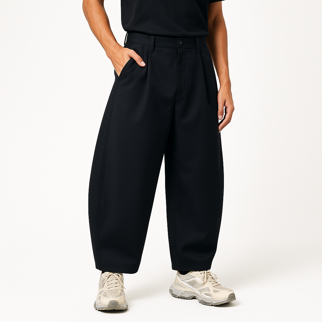 Model wearing the black barrel pant with white sneakers - Future-Homme