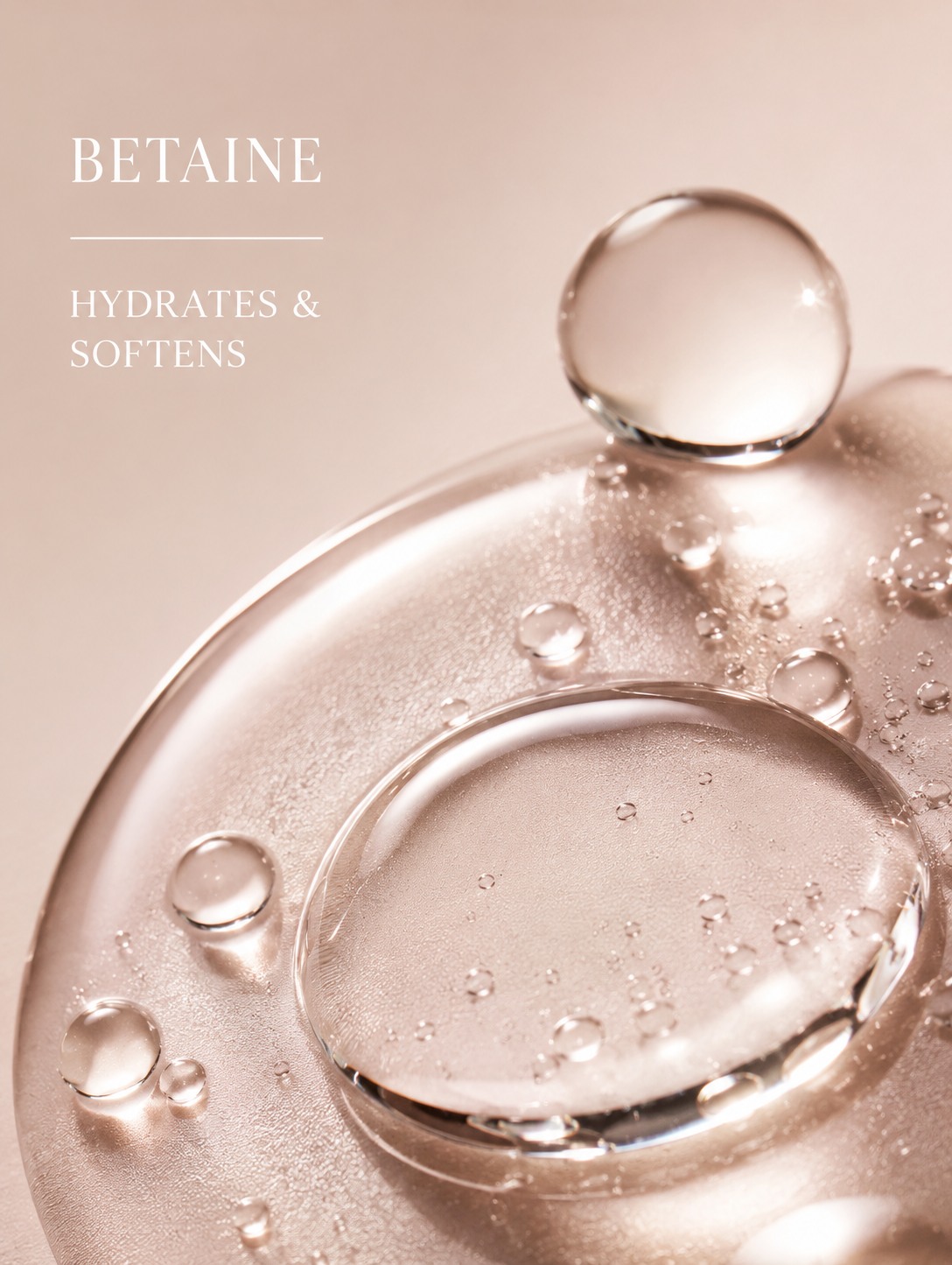 Close-up of water droplets on a textured surface with 'BETAIN' text.