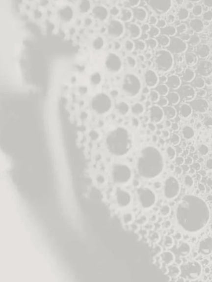 Close-up of soap bubbles on a white background