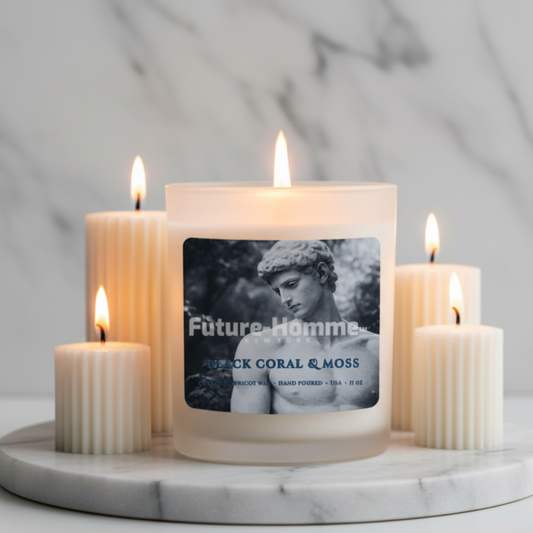 Candle with a label featuring a classical sculpture on a marble surface with other candles.