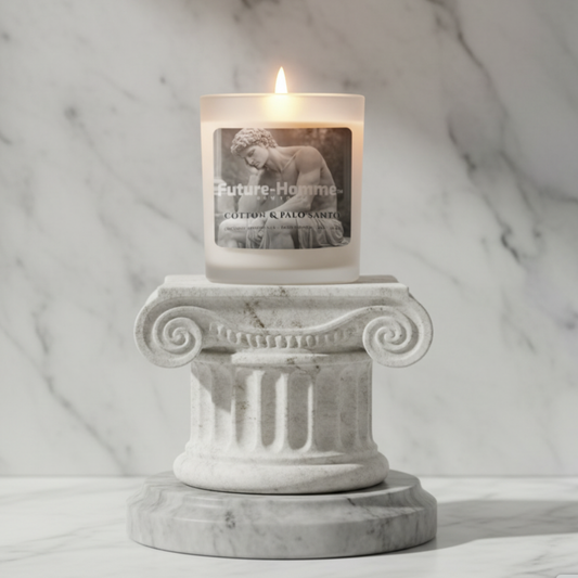 Candle in a decorative holder with a marble background