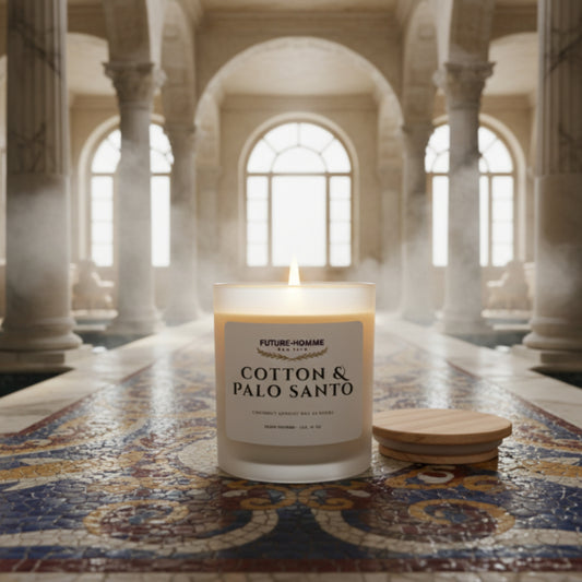 Candle labeled 'Cotton & Palo Santo' in a grand architectural setting with columns and arches.