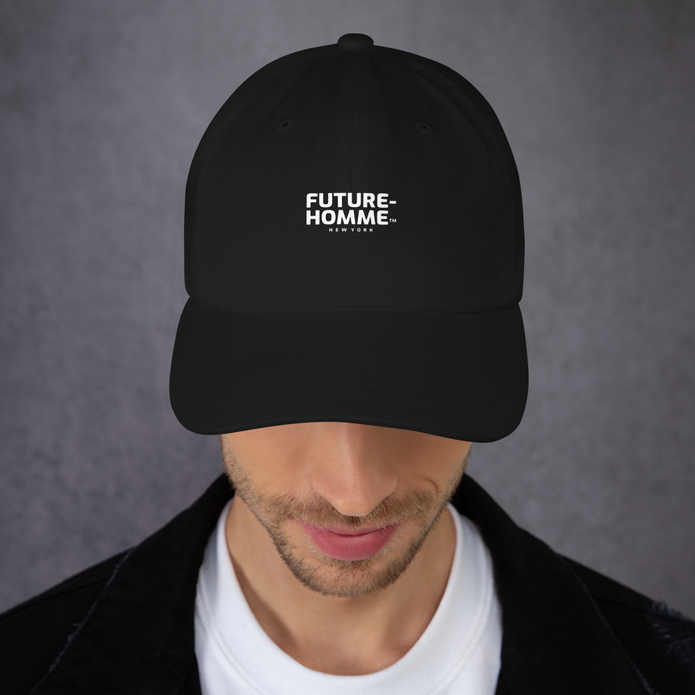 Person wearing a black cap with 'FUTURE-HOMME' logo on a gray background