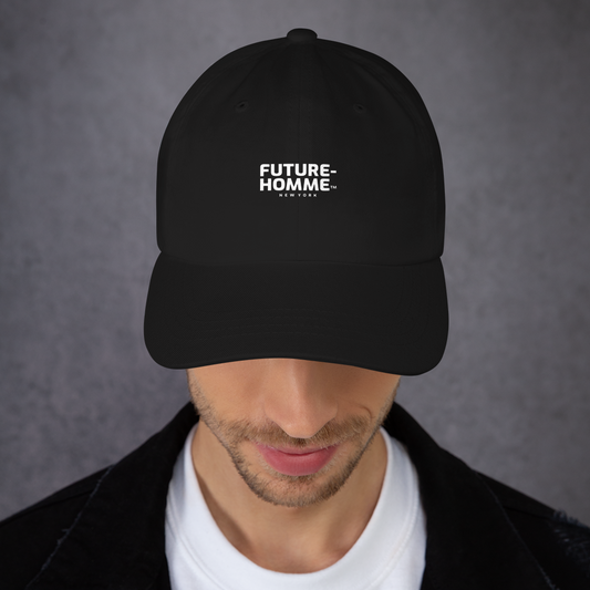Person wearing a black cap with 'FUTURE-HOMME' logo on a gray background