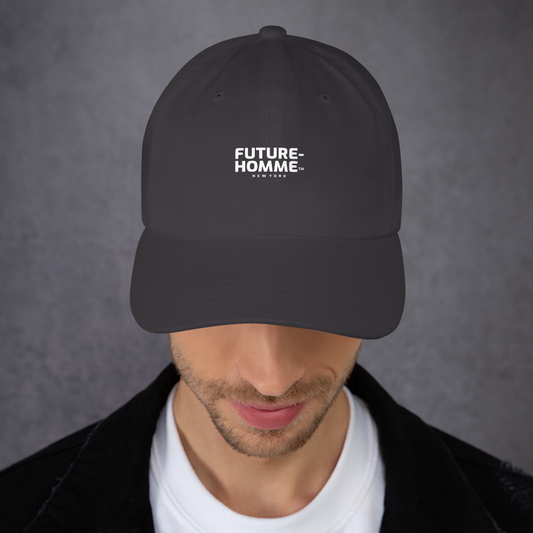 Person wearing a dark gray cap with 'FUTURE-HOMME' logo on a gray background
