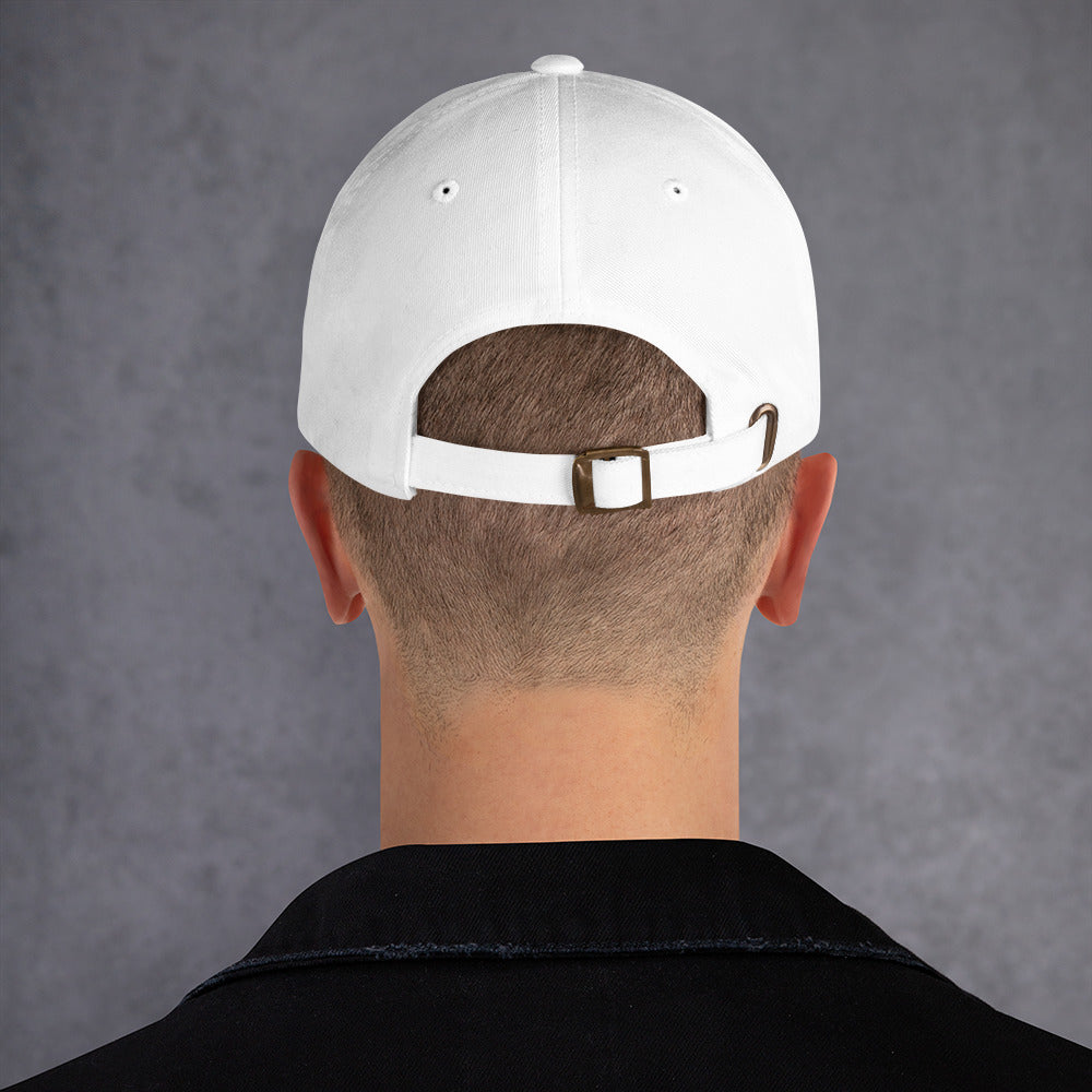 Backside of male model wearing a white baseball cap with adjustable strap on a grey background. 
