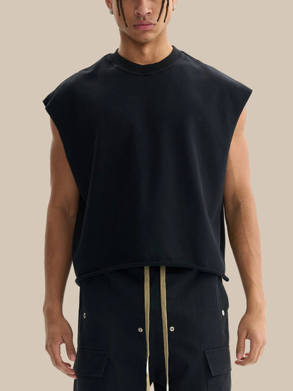 Model wearing the sustainable Future-Homme daily uniform French Terry boxy tank top in 340 GSM in black frontside on a white background
