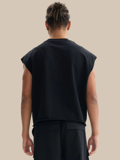 Model wearing the sustainable Future-Homme daily uniform French Terry boxy tank top in 340 GSM in black backside on a white background