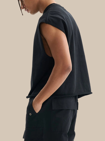 Model wearing the sustainable Future-Homme daily uniform French Terry boxy tank top in 340 GSM in black side angle on a white background