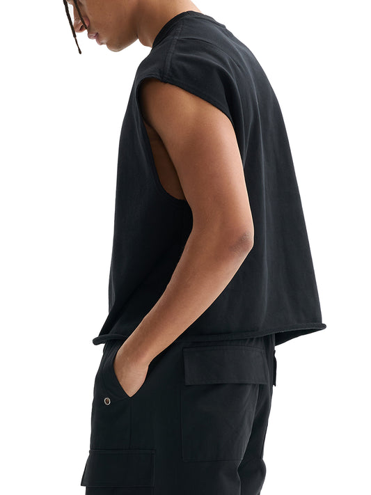 Model wearing the sustainable Future-Homme daily uniform French Terry boxy tank top in 340 GSM in black side angle on a white background
