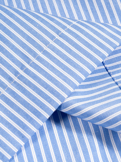 Flat lay of the sustainable 100 GSM Future Homme daily uniform oversized short sleeve vertical striped boxy shirt fabric swatch in blue. 