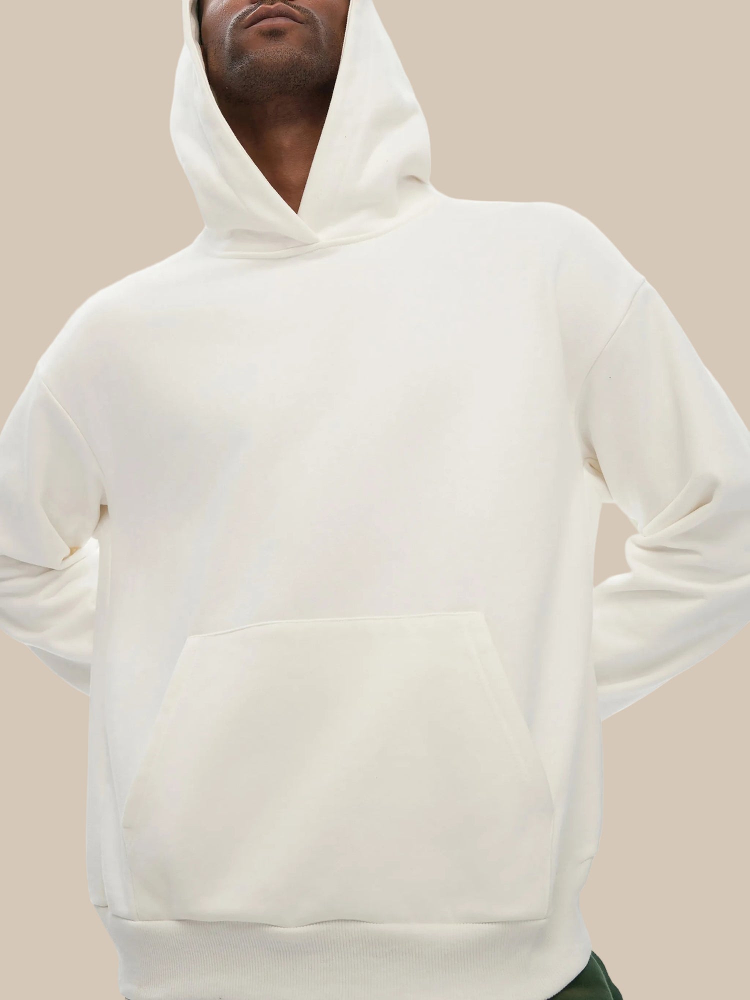 Model wearing the white sustainable 460 GSM Future-Homme daily uniform structured hoodie on a white background 