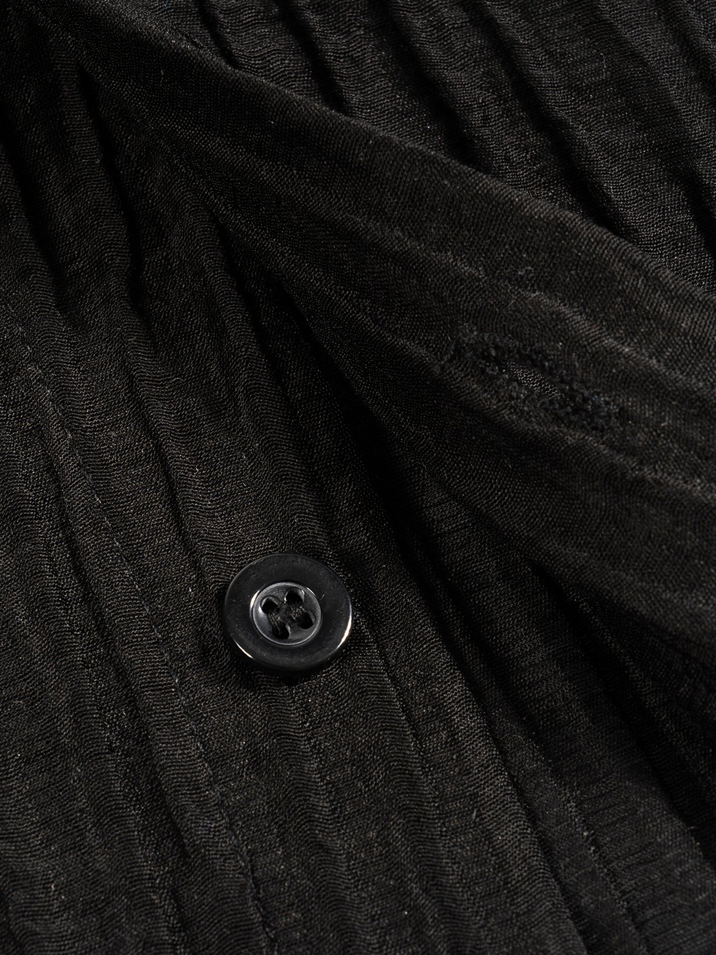 Flat lay of the sustainable Future-Homme daily uniform, tencel jacquard button down in black frontside button on a white background