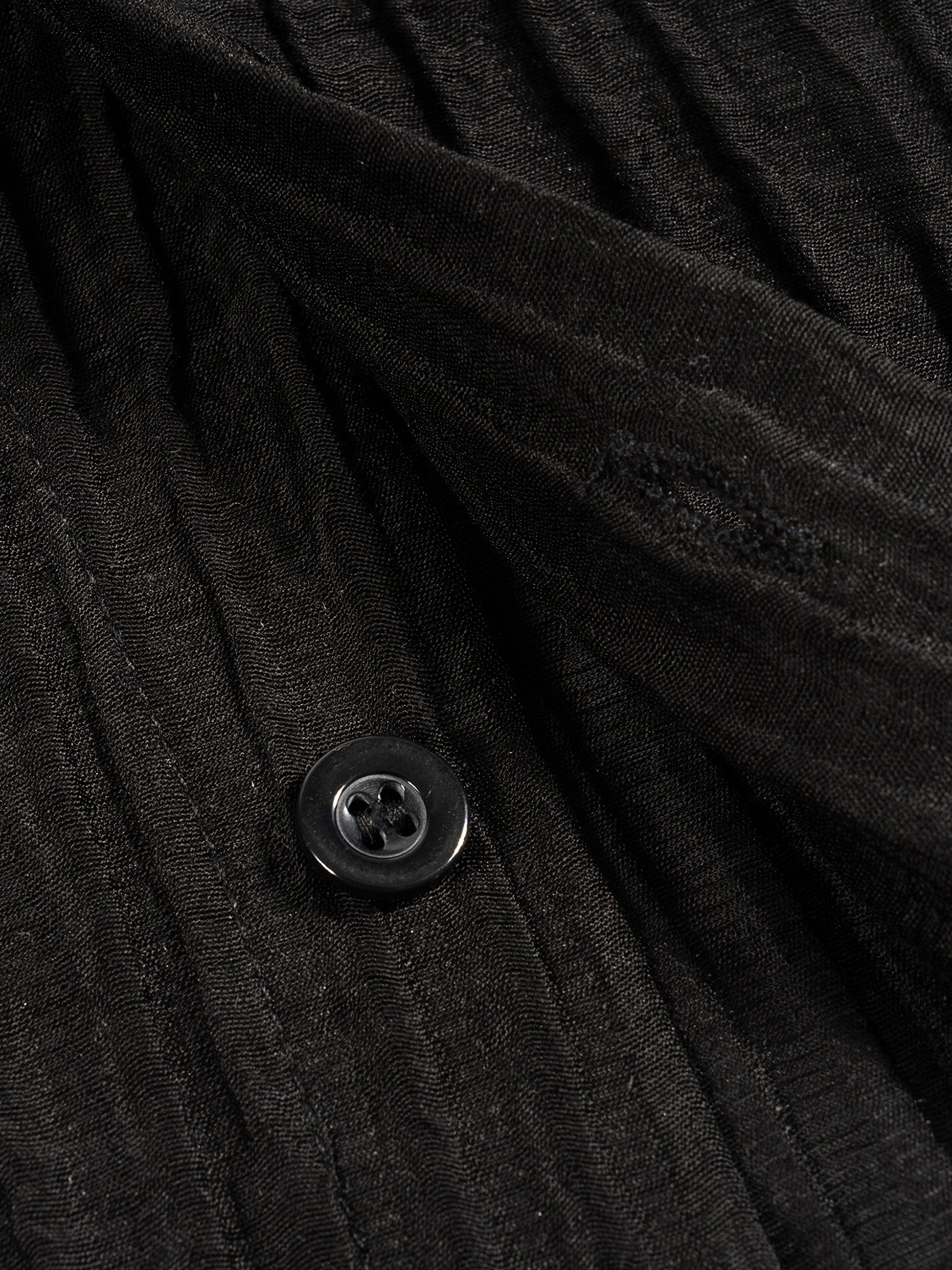 Flat lay of the sustainable Future-Homme daily uniform, tencel jacquard button down in black frontside button on a white background