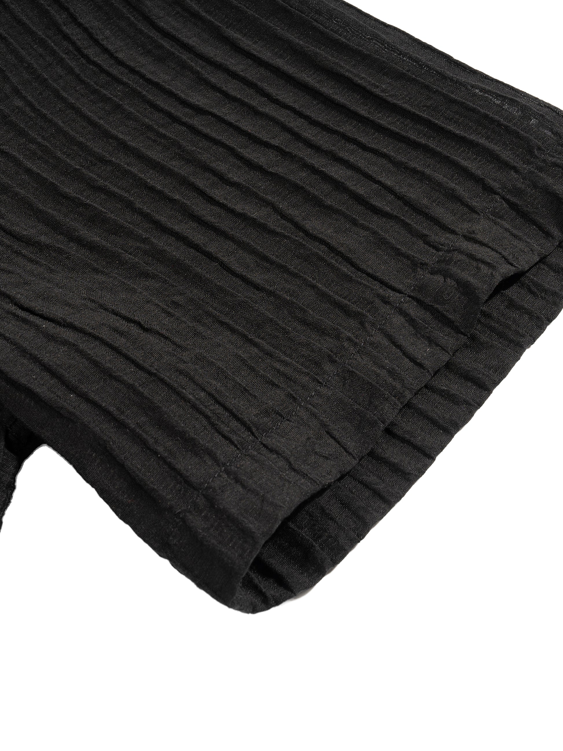 Flat lay of the sustainable Future-Homme daily uniform, tencel jacquard button down in black frontside sleeve on a white background