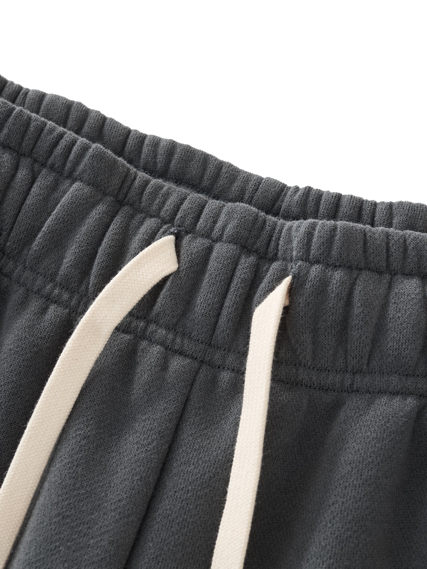 Close up image of the drawstring of a Future-Homme three quarter length sweatpant in 350 GSM in Black, shown on a White background.
