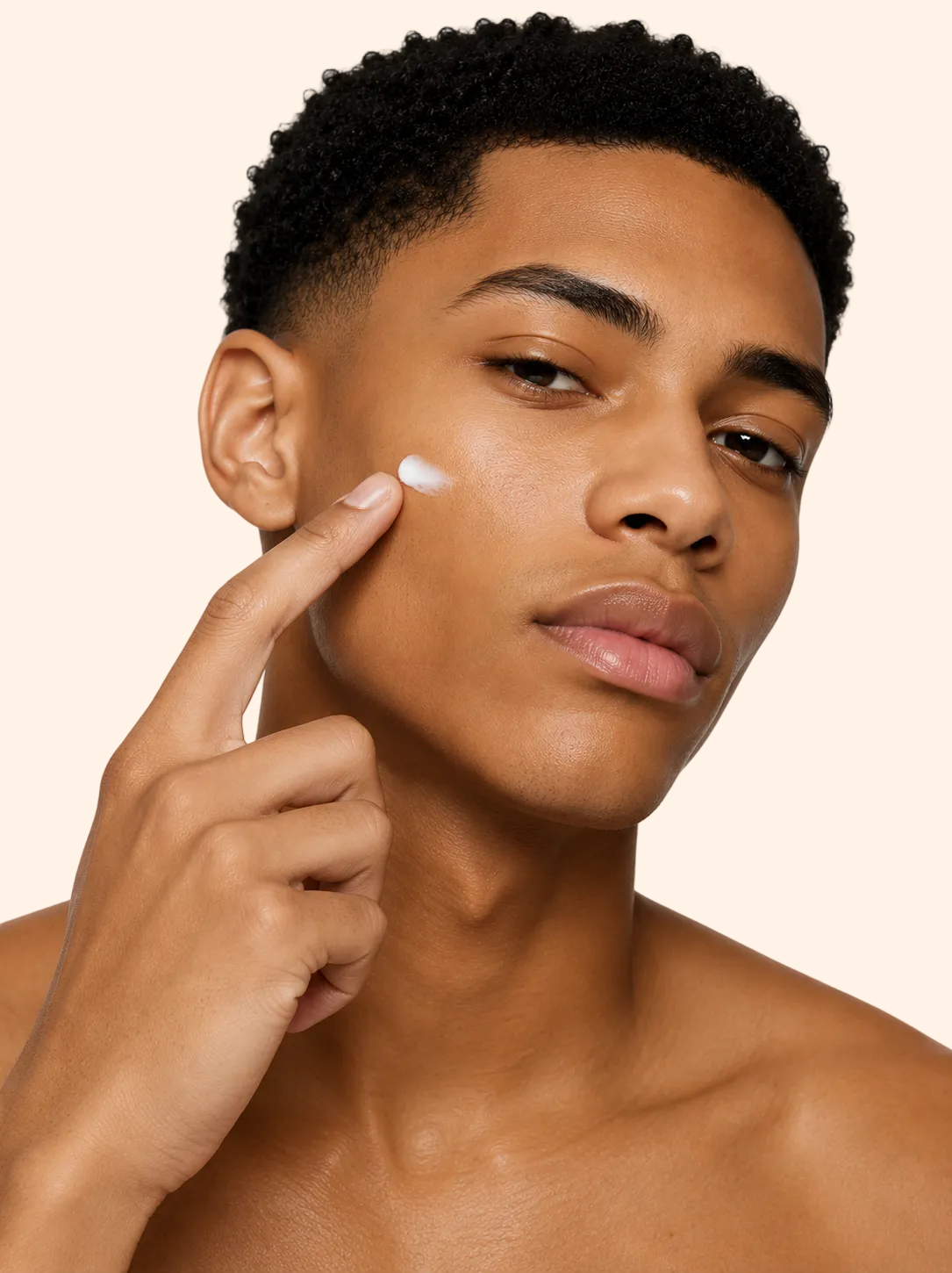 Man applying future-homme anit-age day cream to his face with a neutral background