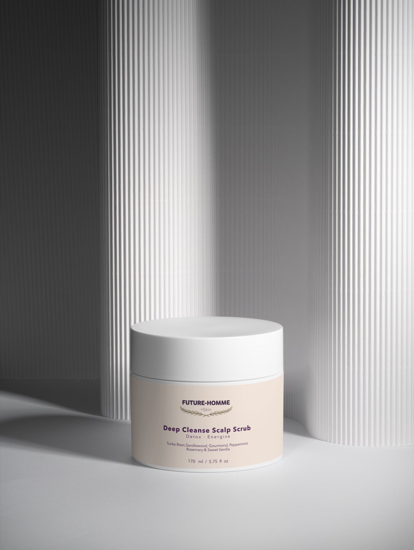 Jar of 'Future Homme' deep cleanse scalp scrub on a neutral background