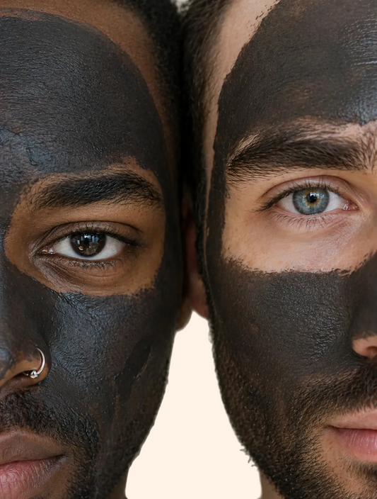 Two men with face masks on a neutral background