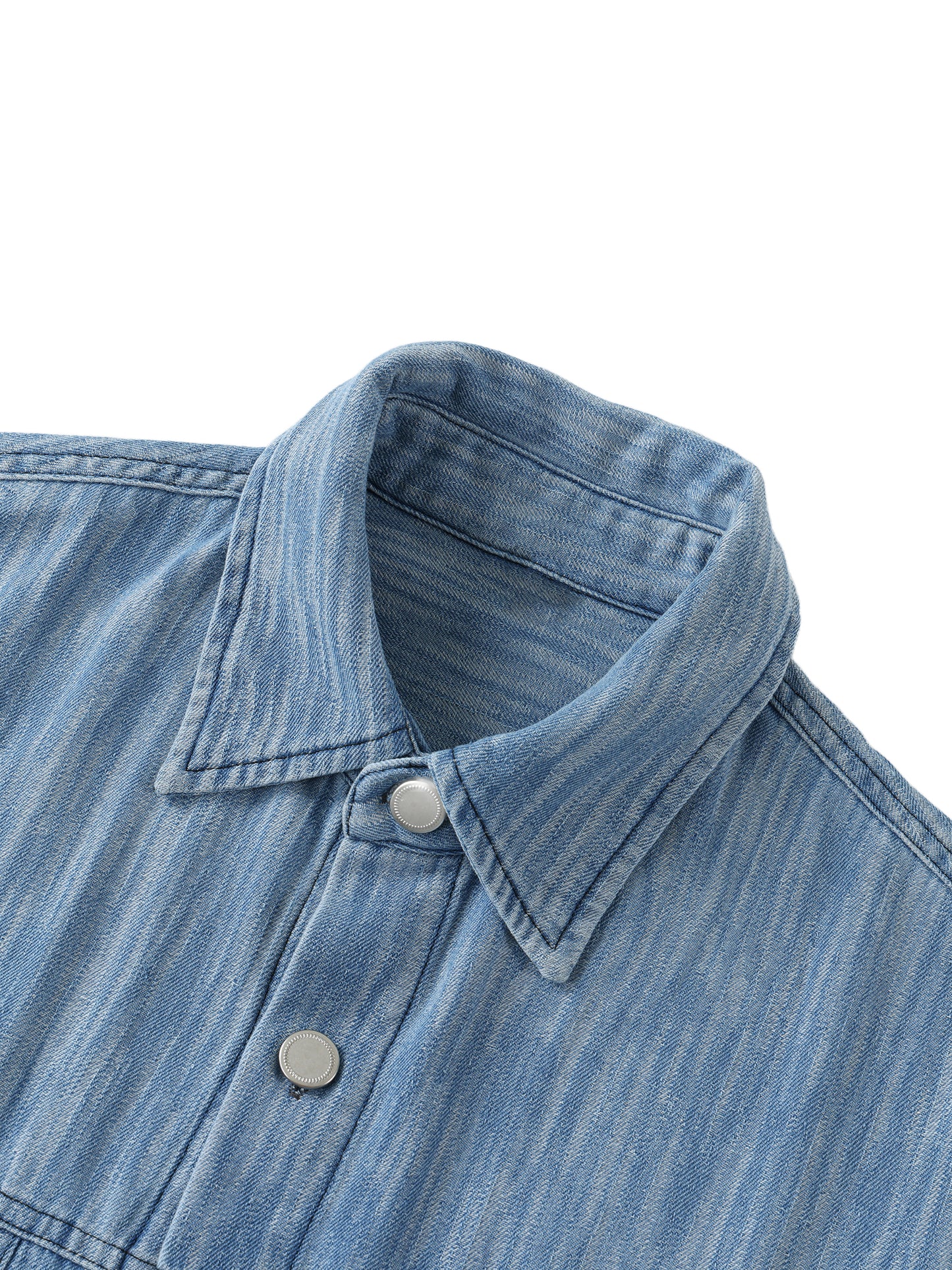 Flat lay of sustainable 230 GSM Future-Homme denim forward distressed short sleeve button down shirt blue frontside collar on a white background 